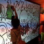 The Psychology of Graffiti: Why Guests Love Interacting with Digital Graffiti Walls